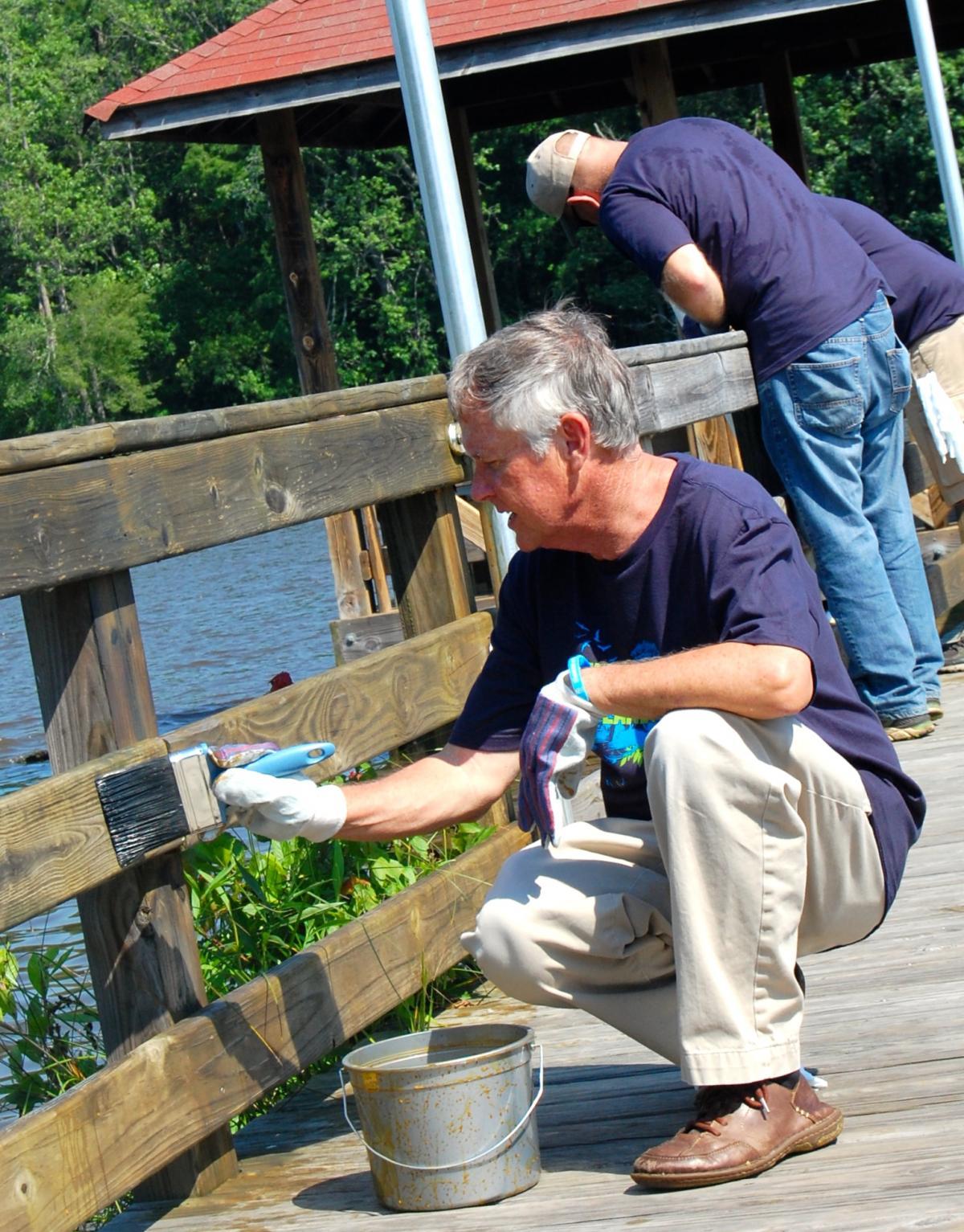 SCA volunteers help reseal the boardwalk in historic Plymouth, North Carolina