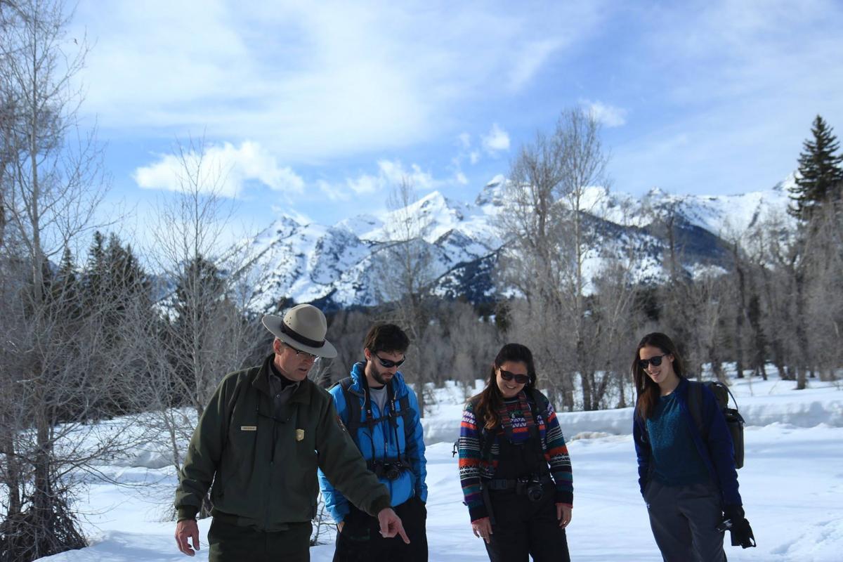 Ranger pointing out signs of wildlife at Grand Teton National Park. 