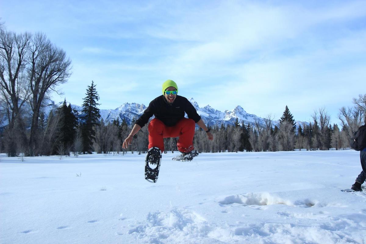 Jumping in snowshoes at Grand Teton National Park.